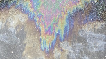 Background of oil spill on asphalt