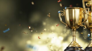 Golden trophy cup on dark background. copy space for text. 3d rendering.