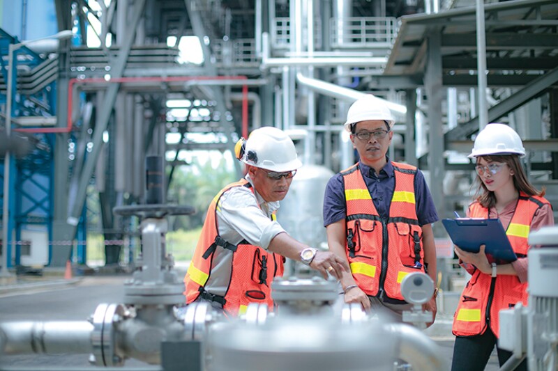 safety manager accompanied by his secretary and engineers conduct inspection