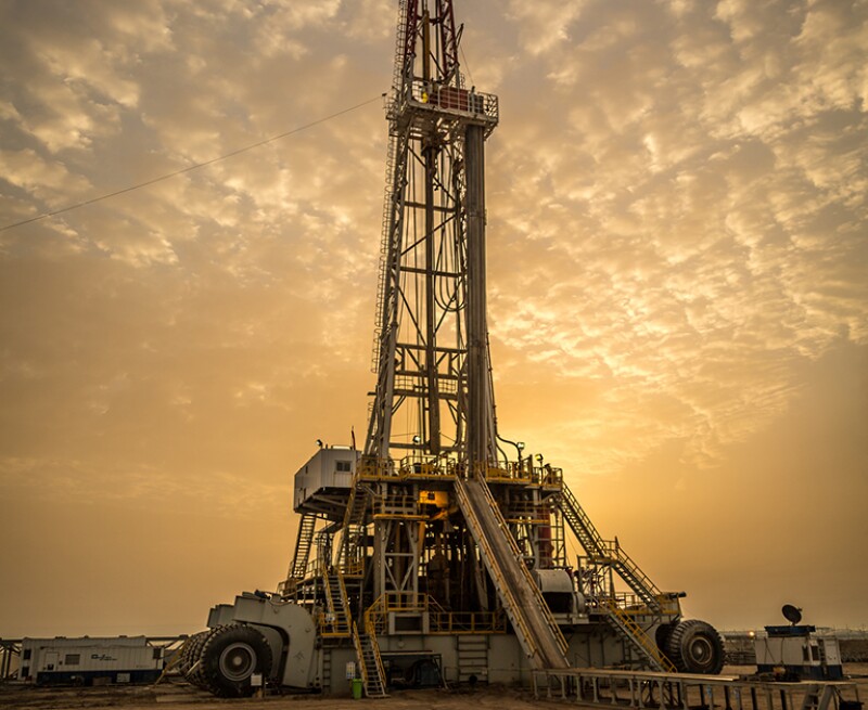 Oil drilling rig at dawn