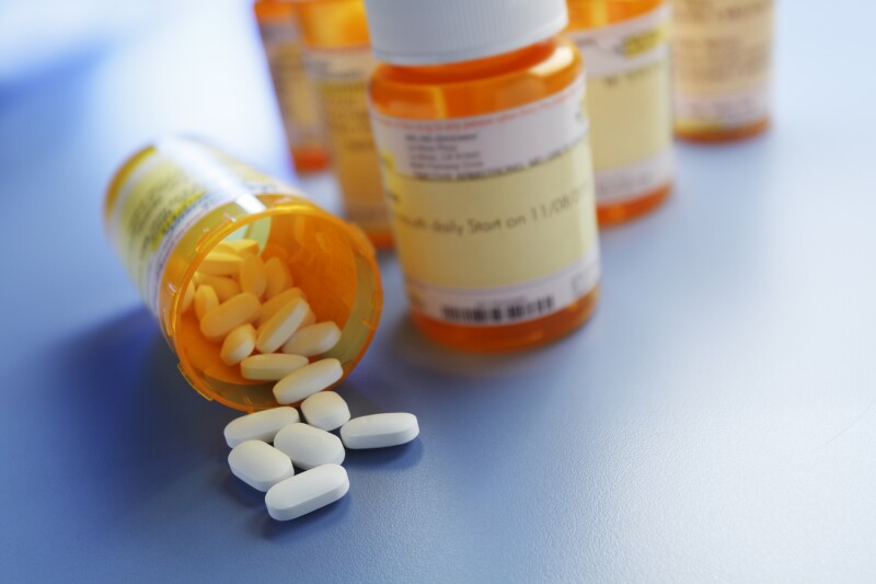 Pills Pouring Out Of Prescription Medication Bottle