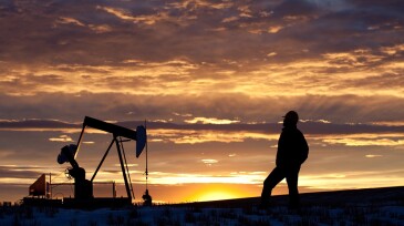 Oilfield Worker or Geologist at Sunrise by Pumpjack
