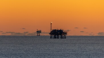 Offshore Drilling Platforms during Sunset in the Gulf of Mexico