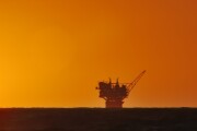 oil production platform and the sun