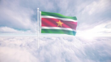 Suriname flag waving above the clouds, The concept of liberty and patriotism, national flag waving proudly above the clouds, symbolizing freedom, independence day, celebration, freedom, patriotic, power and freedom,