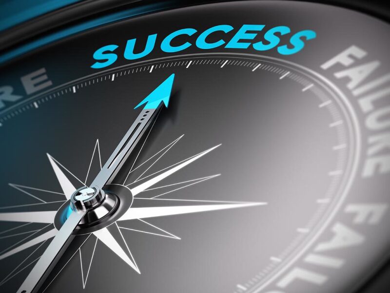 Compass pointing to Success
