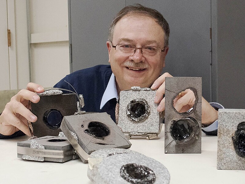Paul Woskov, MIT research engineer, displaying samples in his lab in 2016.