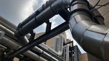 This maze of pipes connecting buildings in a hospital complex in Texas are evidence of a district heating system, which in this case is fueled by natural gas. Source: Stephen Rassenfoss.