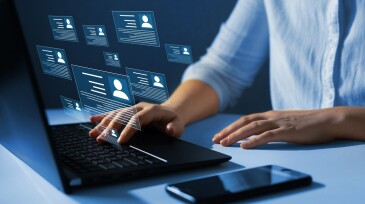 Human resource manager checks the CV online to choose the perfect employee for his business.Online and modern technologies for simplifying the human resources system. HR(human resources) technology.