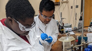 Tchemongo Berte (left) is studying low-salinity waterflooding assisted by a fellow University of Oklahoma grad student, Nayem Ahmed, whose research supports alternative energy.