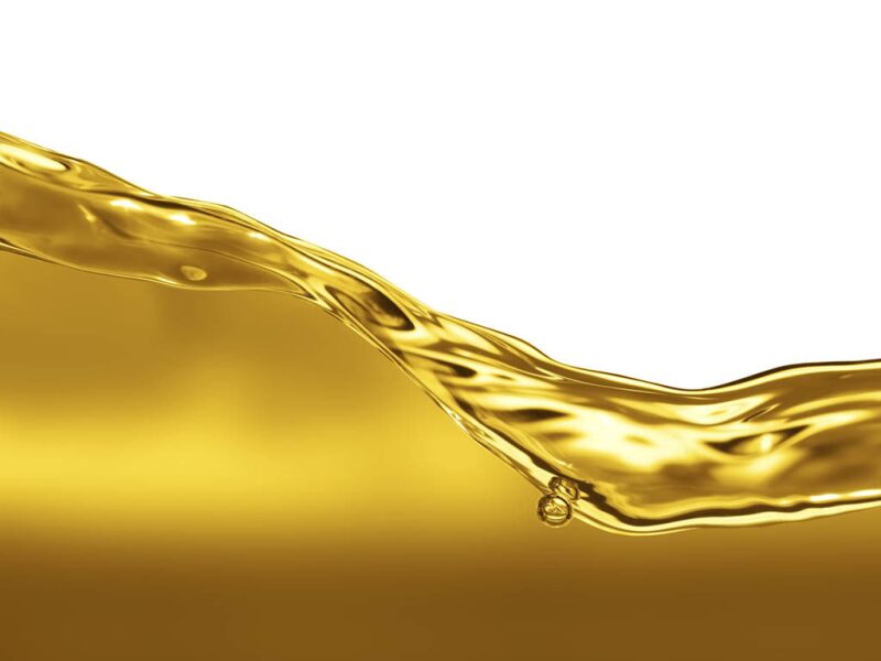 light-colored oil flowing in a container