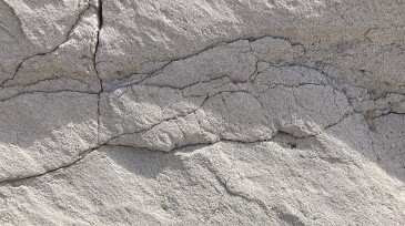 Surface fractures offer hints of fractured rock deep in the ground researchers are working to tap for water heating.
