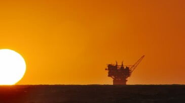 oil production platform and the sun