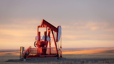 A pumpjack on the prairie. Alberta, Canada. This oil rig is located near Turner Valley, Alberta