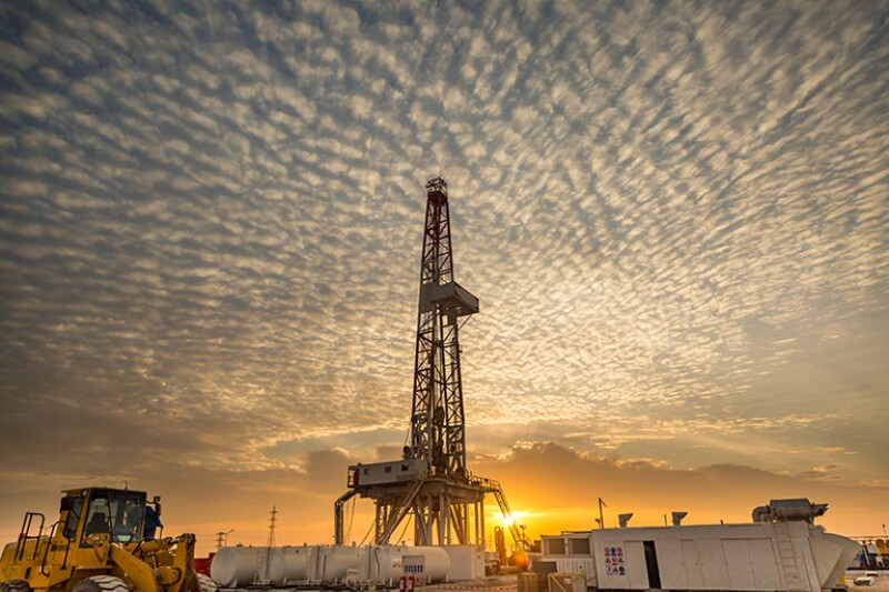 Drilling rig at sunset