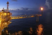 Offshore oil and gas or rig platform with beautiful sky in the evening time for oil and gas business concept.