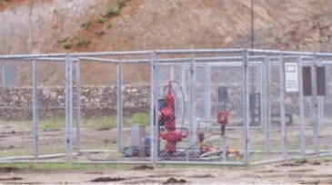 Wellhead with wire mesh protection.