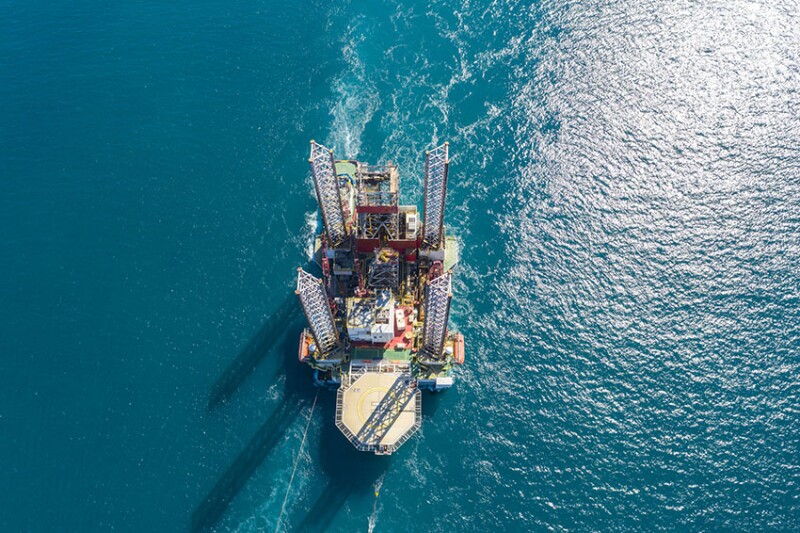 Oil rig on offshore area stock photo. Aerial view offshore jack up rig being towed to the location