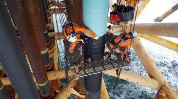 The Stopaq system being applied to an offshore structure in a bid to stifle corrosion brought on by the elements at sea. Source: Seal for Life.