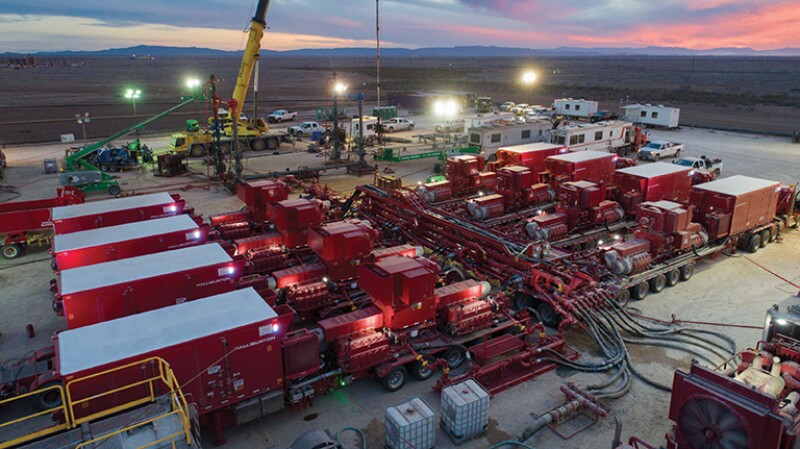 Red containers at station in large field