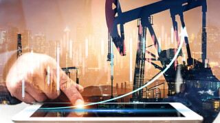 Businessman using digital tablet. Business global internet connection application technology digital marketing, Crude Oil pump oil rig energy industrial machine background. Crude oil increase price