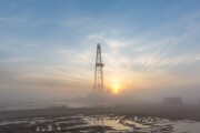 Fracking oil rig in the morning fog