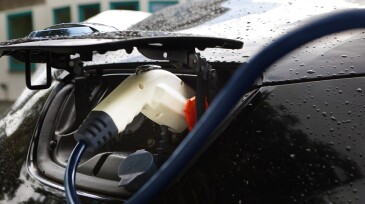 Electric car being charged outside home