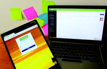 Computer and ipad showing customer software