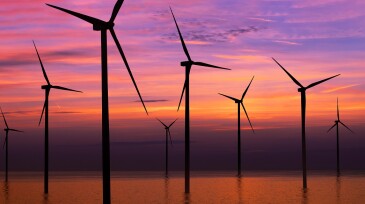 Wind turbine farm in beautiful nature landscape.