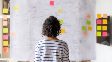 Business woman creating a business plan at the office