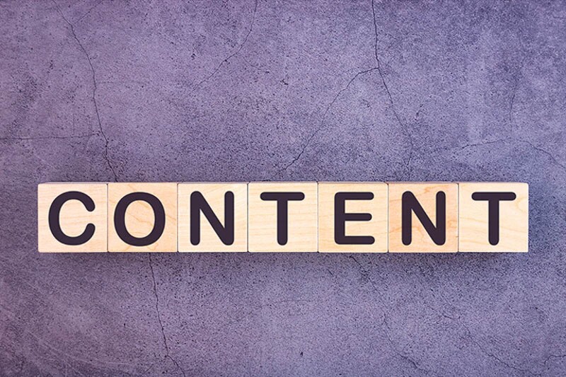 CONTENT word made with wood building blocks.