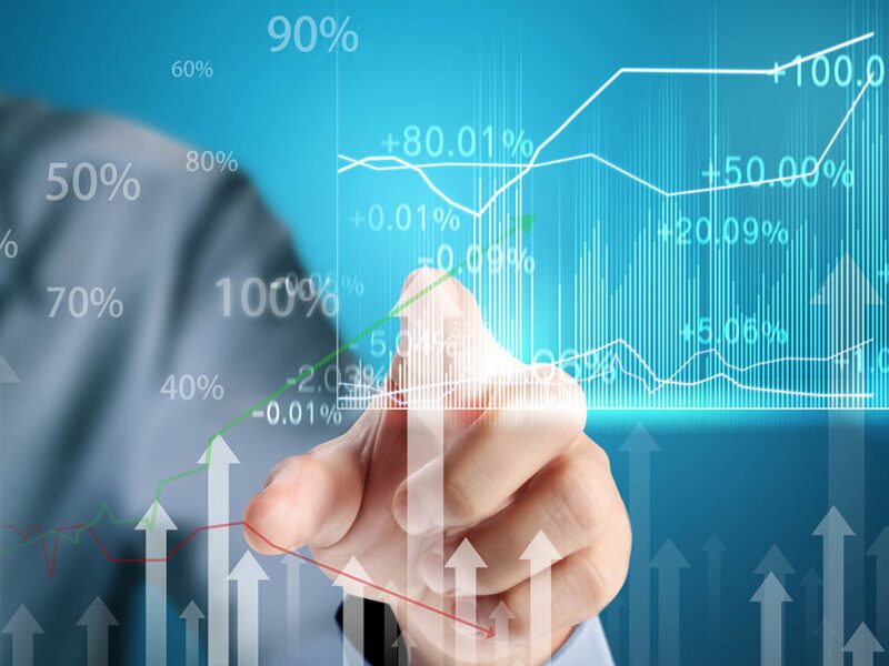 Finger touching a clear panel containing a chart