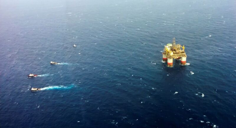 Supply boats leaving an offshore platform