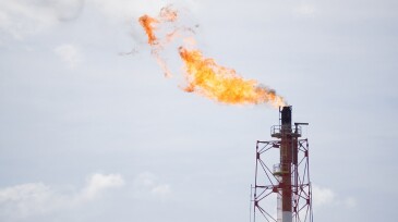 Fire flare burn on offshore platform.