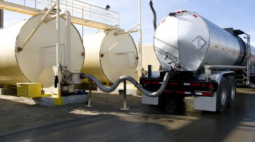 Tanker Transferring Oil into Fuel Tanks