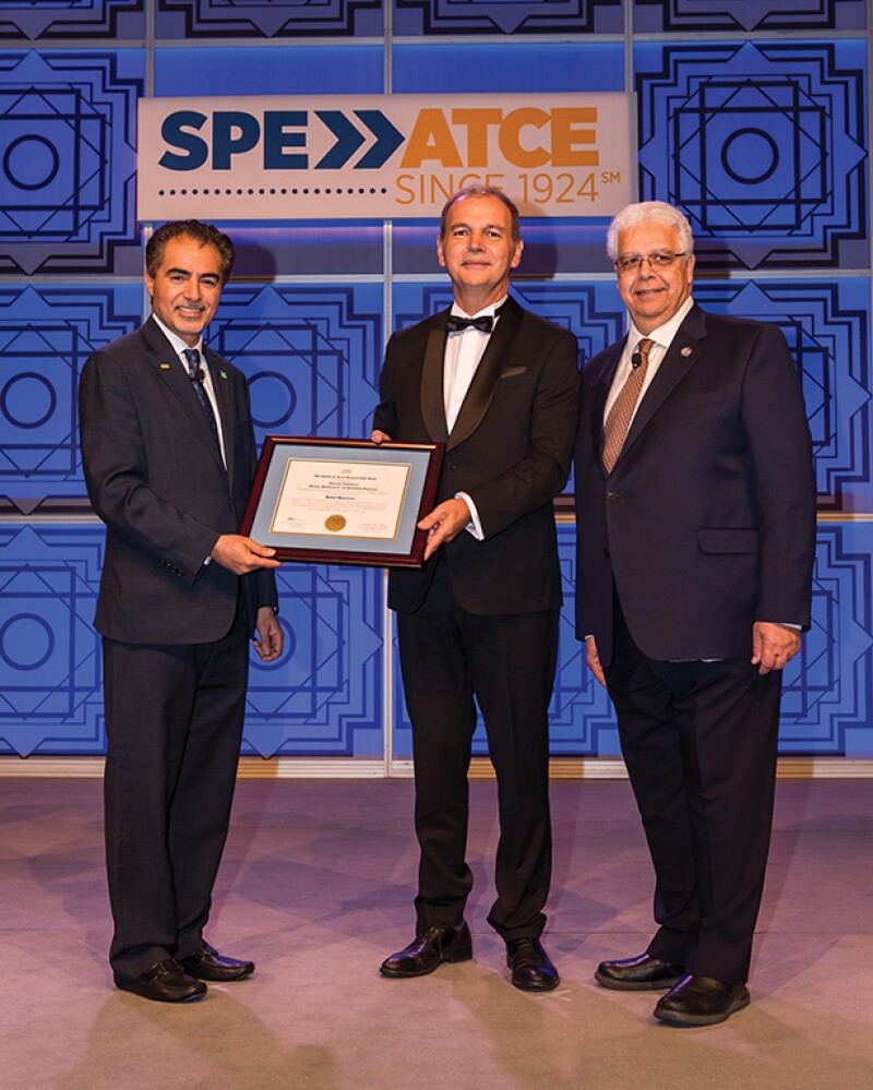 Ben-Naceur received the 2019 AIME Charles F. Rand Memorial Gold Award, presented by SPE President Sami Al-Nuaim. Pictured on the right is 2019 AIME President Hani Henein.