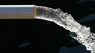 Close-up of water pipe with pouring water