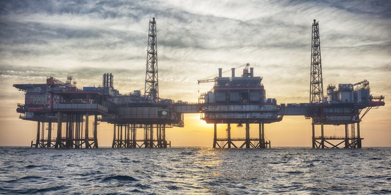 Offshore oil platform at sunset