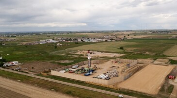 Aerial Drone Clip of a Fracking Drill Rig On The Eastern Slope Of Colorado In Late Springtime