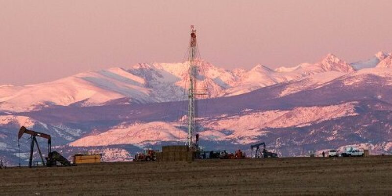 Image of drilling operations in front of Colorado landscape.