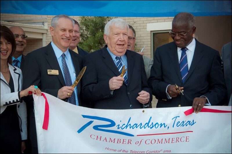 Mark with staff from the Richardson Chamber of Commerce and 2013 President Egbert Imomoh (right) at the official headquarters reopening in Richardson, Texas.