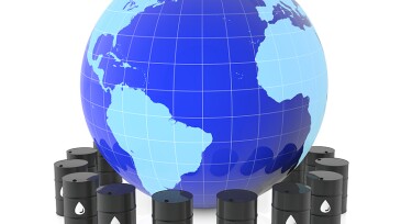 The globe of the earth and oil barrels