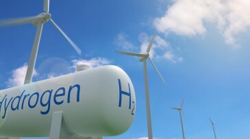 Hydrogen tank and windmills on blue sky background. Sustainable and ecological energy concept. 3d illustration.