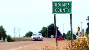 Holmes County sign on road