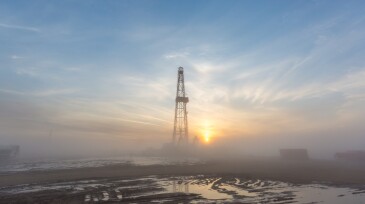 Fracking oil rig in the morning fog