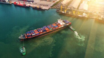 container ship in import export and business logistic.By crane ,Trade Port , Shipping, cargo to harbor, Aerial view, Top view.