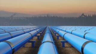 Blue Pipeline Infrastructure at Sunset in Industrial Oil Field