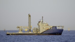 Subsea work vessel with knuckle crane and lift tower