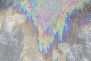 Background of oil spill on asphalt