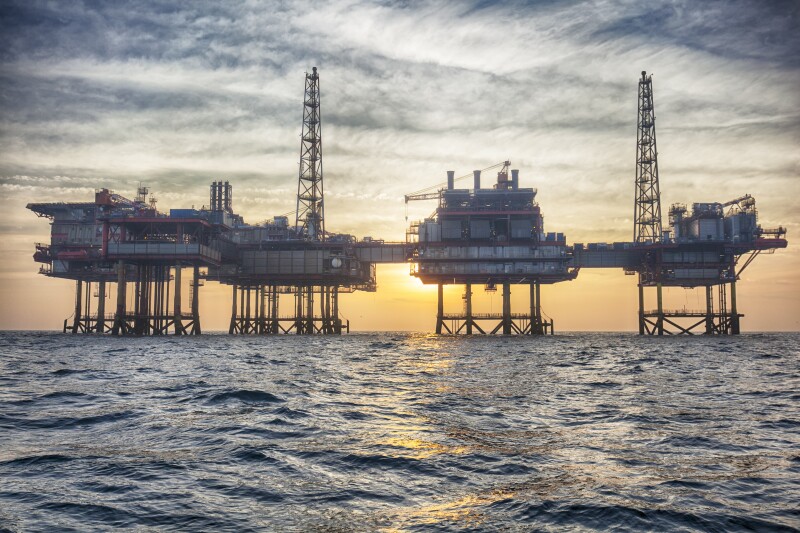 Offshore oil platform at sunset